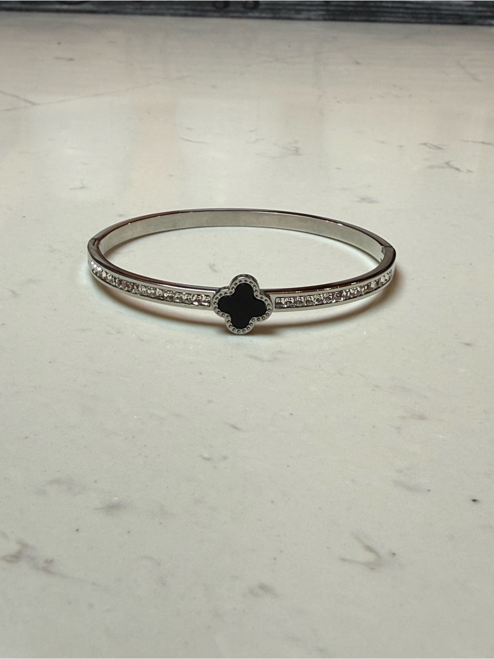 Silver Bangle Bracelet with Black Clover Accent